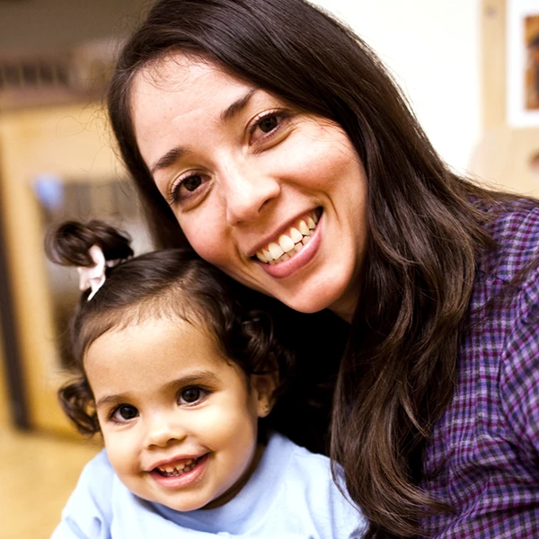 Mother and infant child smiling